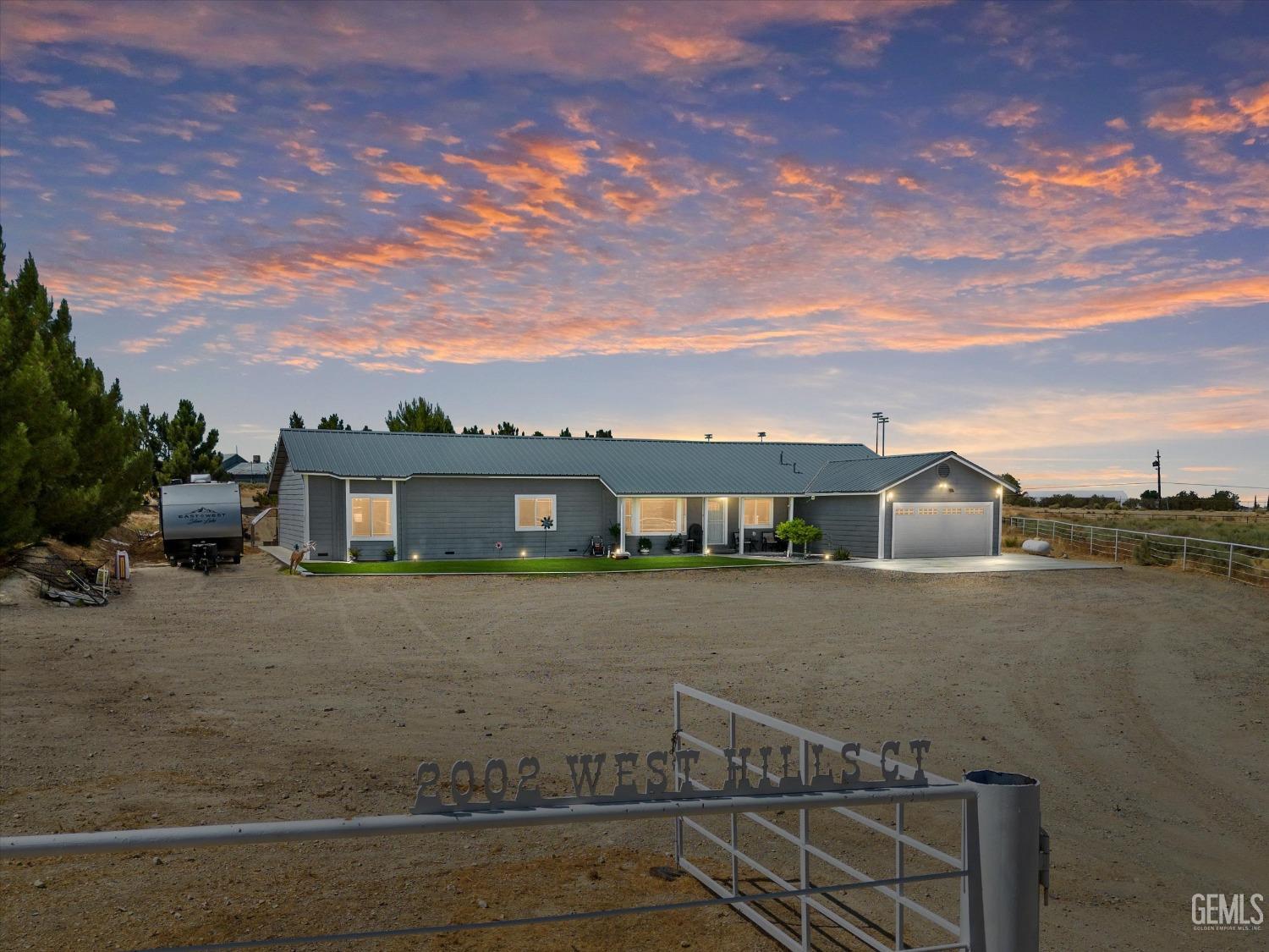 a view of a big house with a big yard