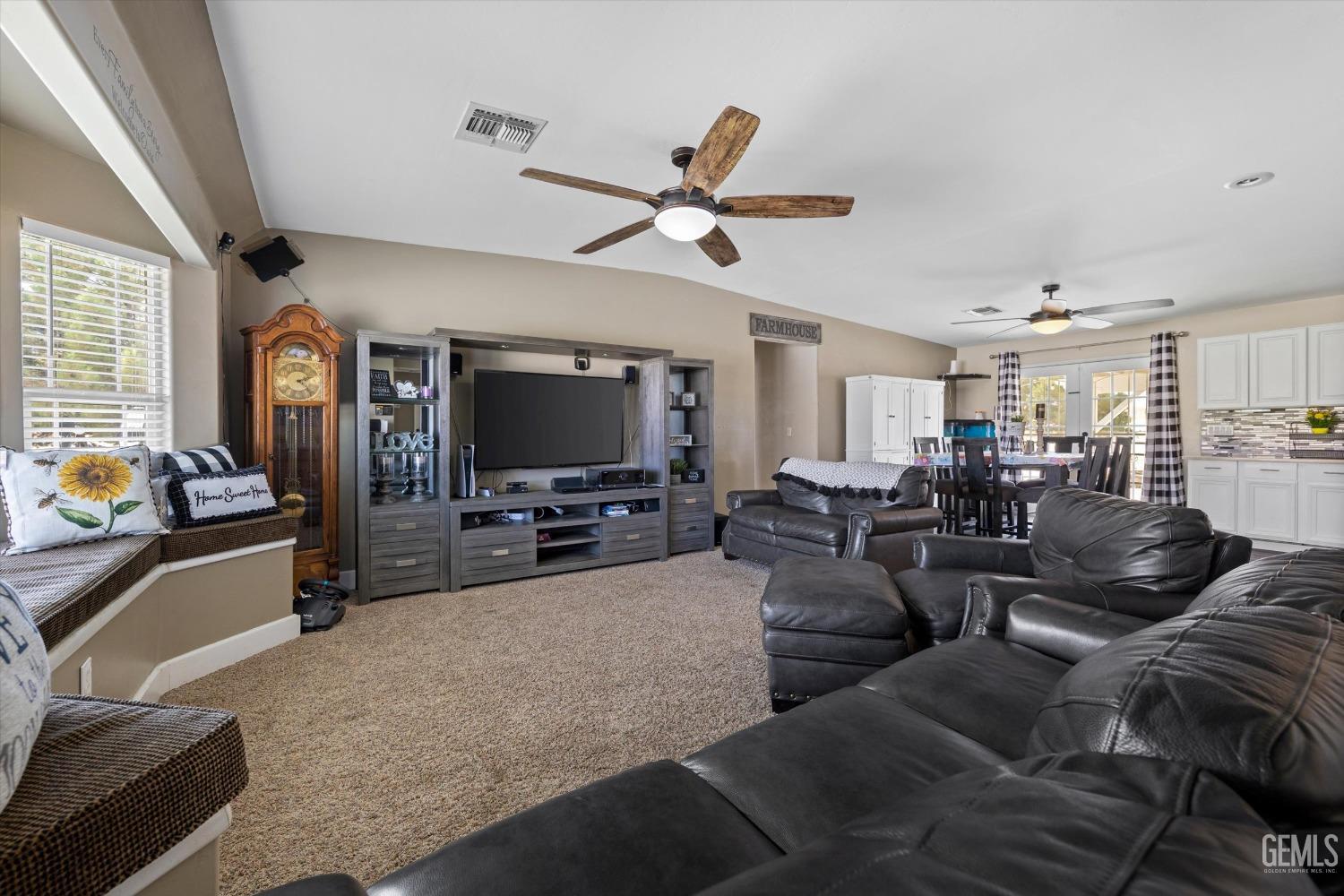 Undisclosed Address Maricopa, CA 93252 - Photo 16 of 47 a living room with furniture and a flat screen tv