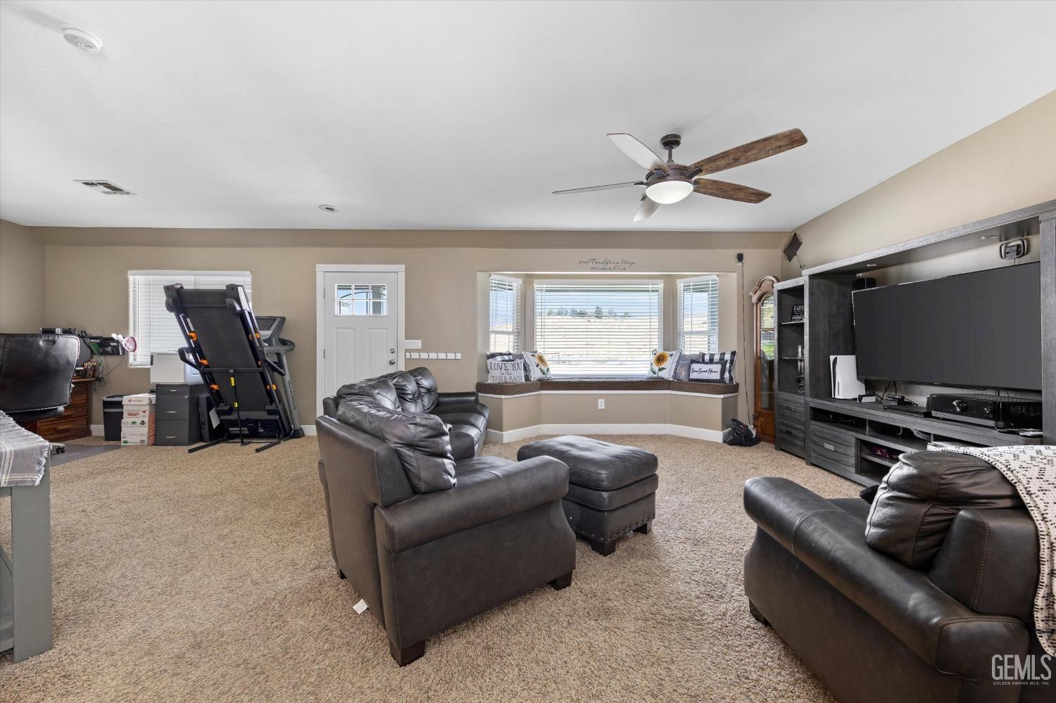 Undisclosed Address Maricopa, CA 93252 - Photo 17 of 47 a living room with furniture and a flat screen tv