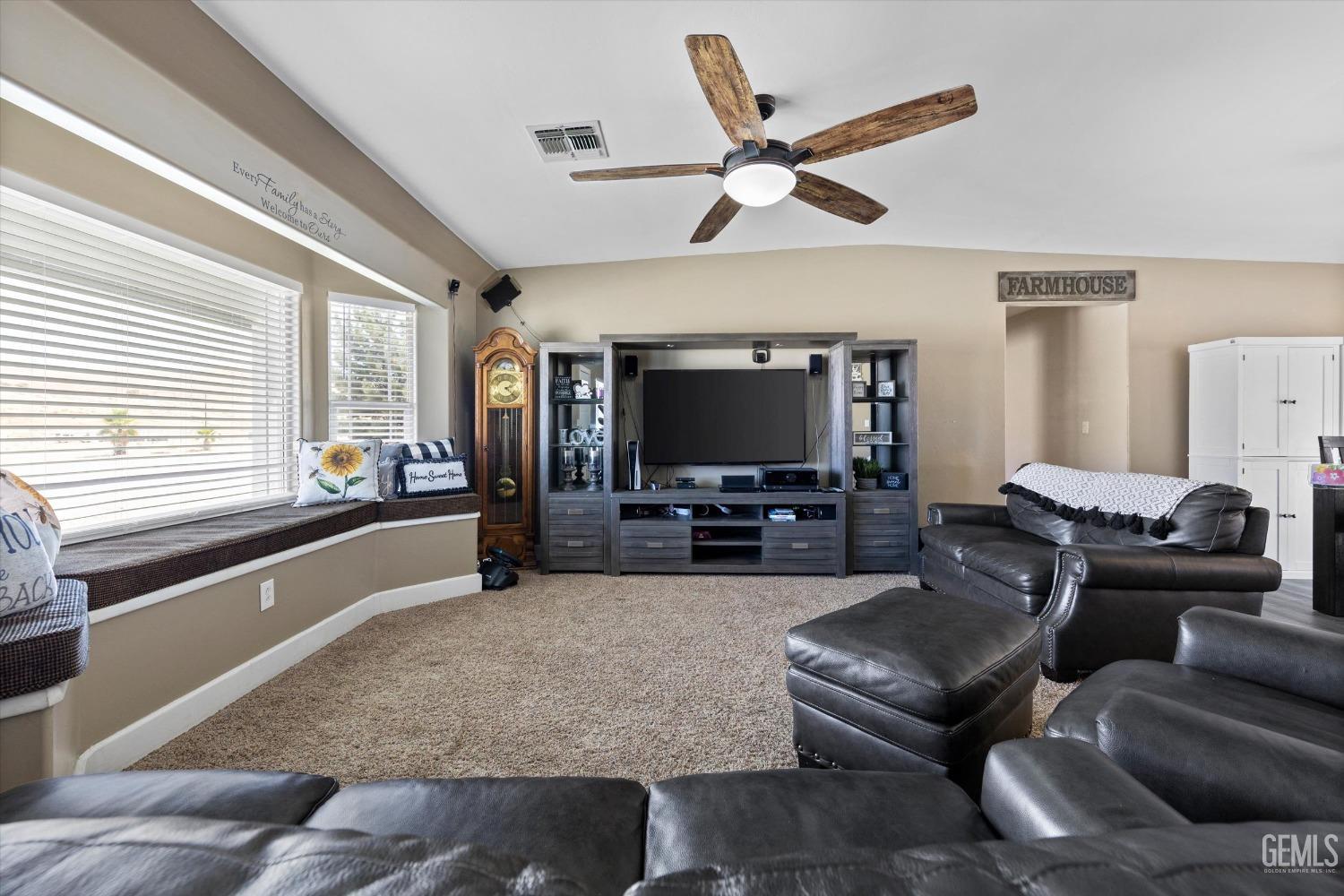 Undisclosed Address Maricopa, CA 93252 - Photo 19 of 47 a living room with furniture and a flat screen tv