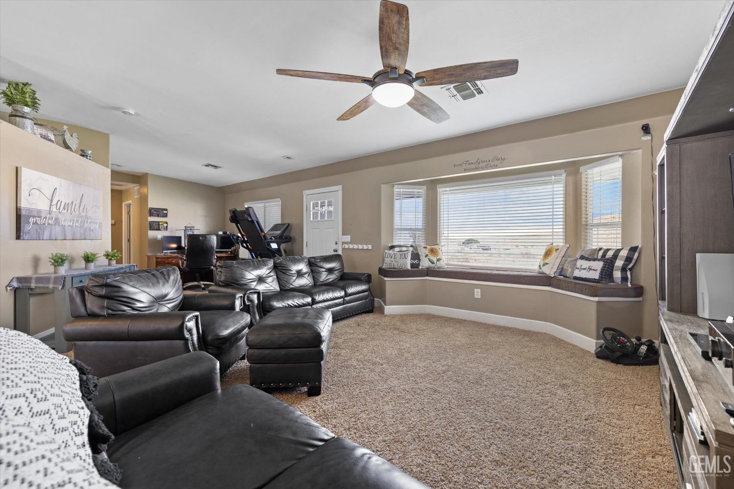 Undisclosed Address Maricopa, CA 93252 - Photo 21 of 47 a living room with furniture and a large window