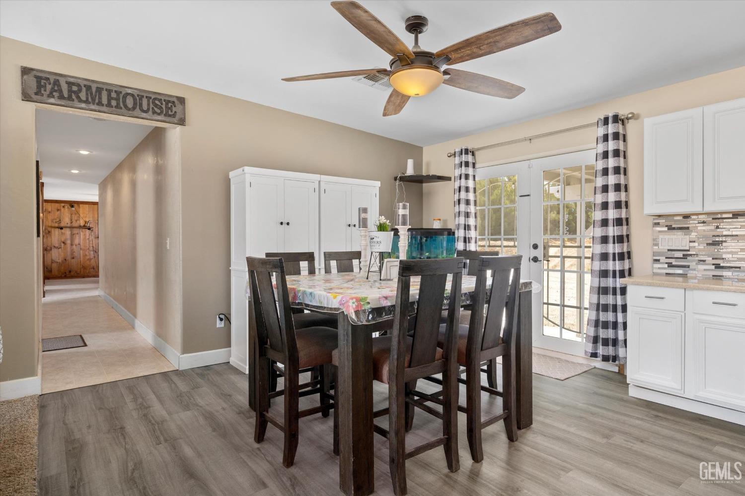 Undisclosed Address Maricopa, CA 93252 - Photo 24 of 47 a view of a dining room with furniture and wooden floor