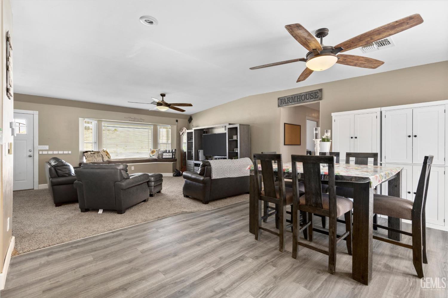 Undisclosed Address Maricopa, CA 93252 - Photo 25 of 47 a living room with furniture kitchen view and a wooden floor
