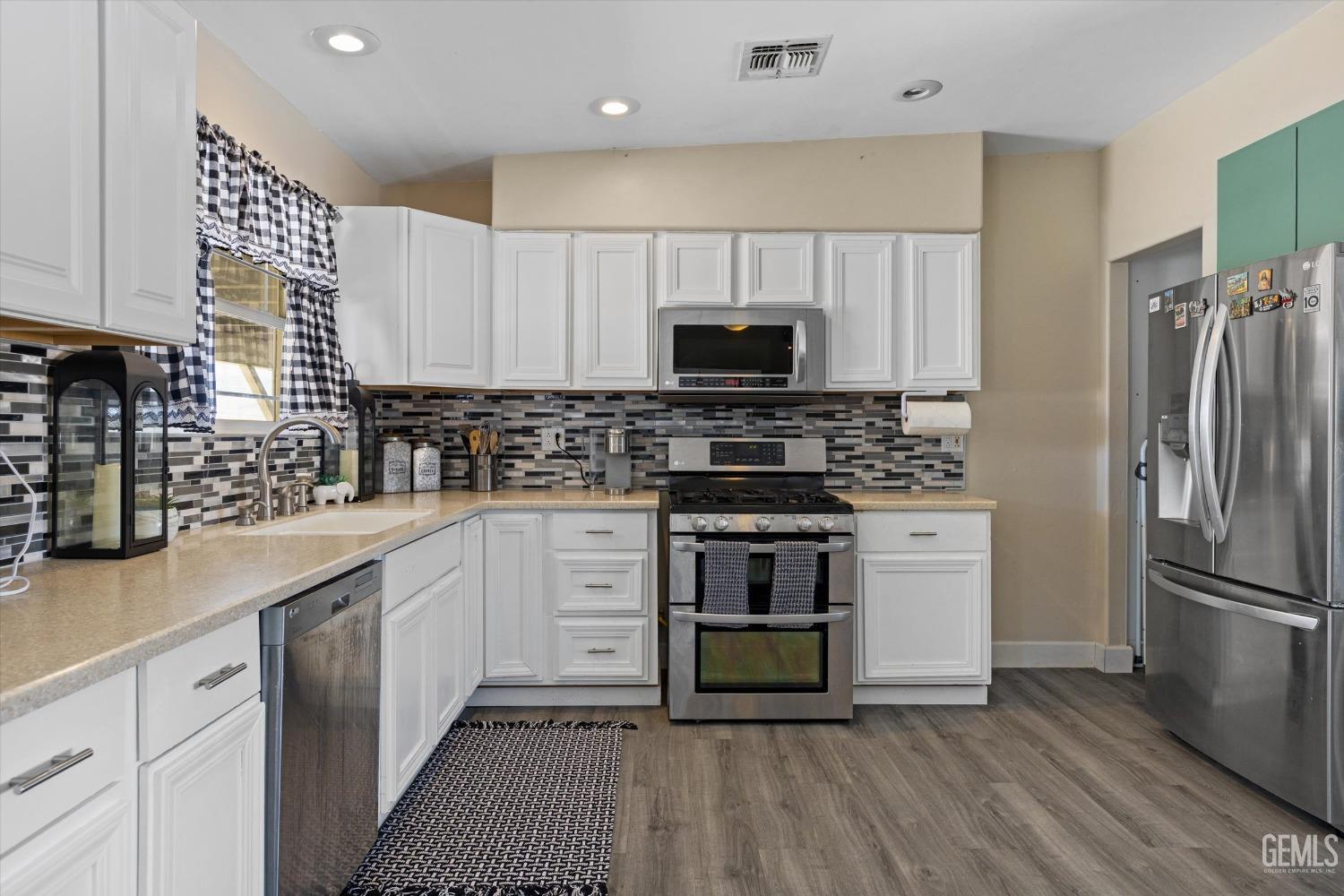 Undisclosed Address Maricopa, CA 93252 - Photo 27 of 47 a kitchen with stainless steel appliances a refrigerator sink and microwave