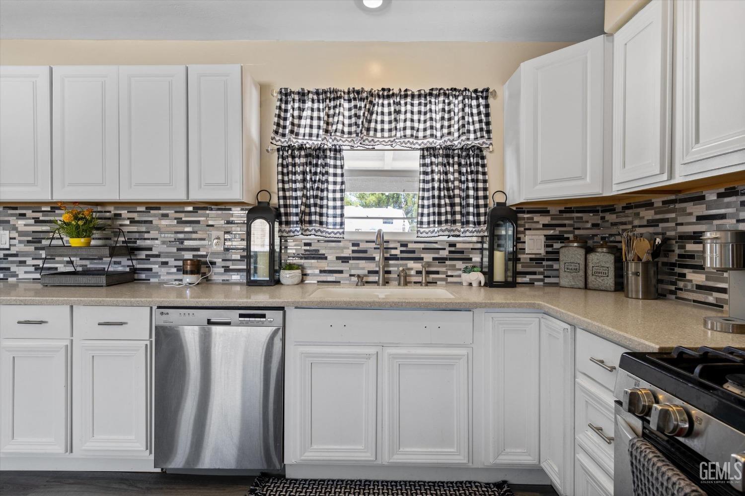 Undisclosed Address Maricopa, CA 93252 - Photo 28 of 47 a kitchen with granite countertop white cabinets and sink
