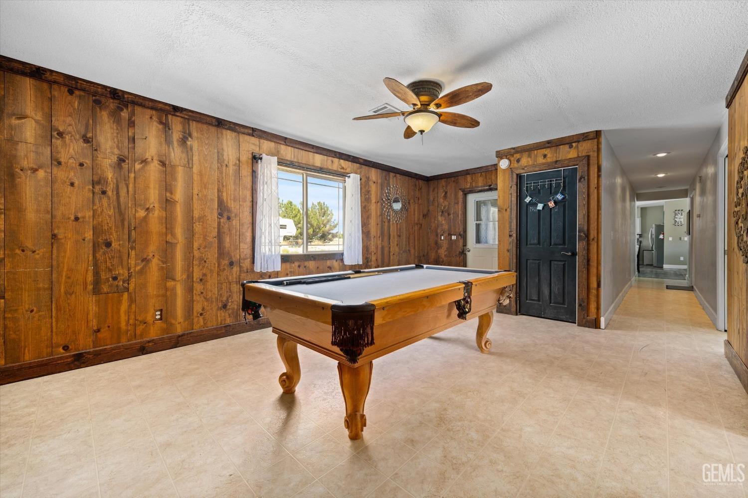 Undisclosed Address Maricopa, CA 93252 - Photo 30 of 47 a room with pool table and a chandelier