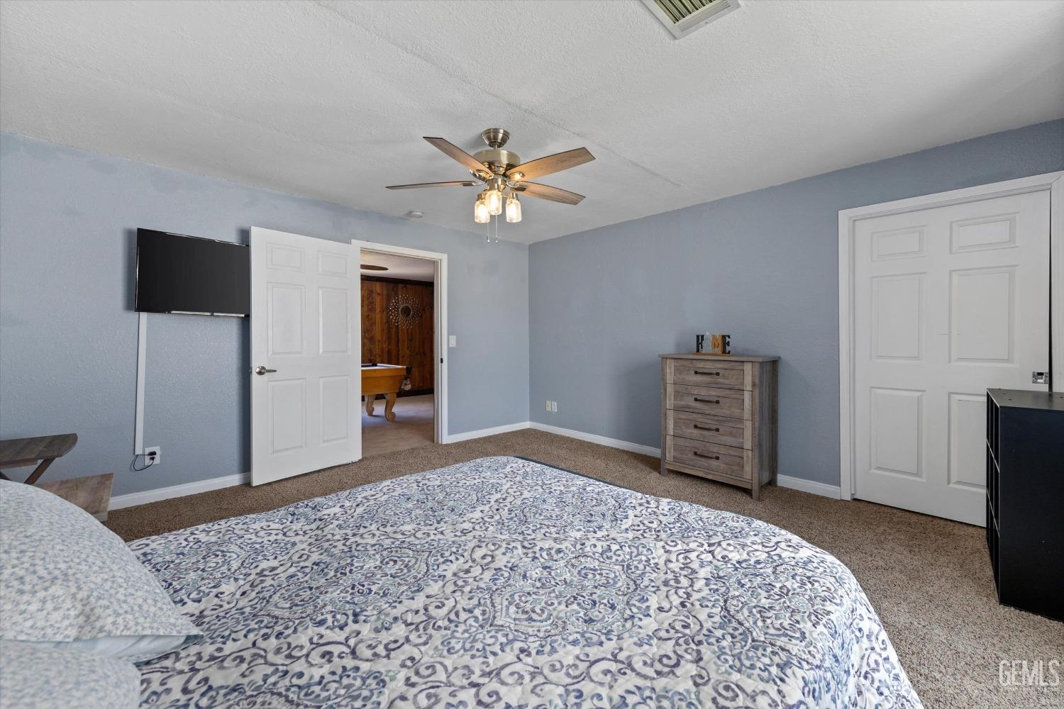 Undisclosed Address Maricopa, CA 93252 - Photo 32 of 47 a bedroom with a bed and a television