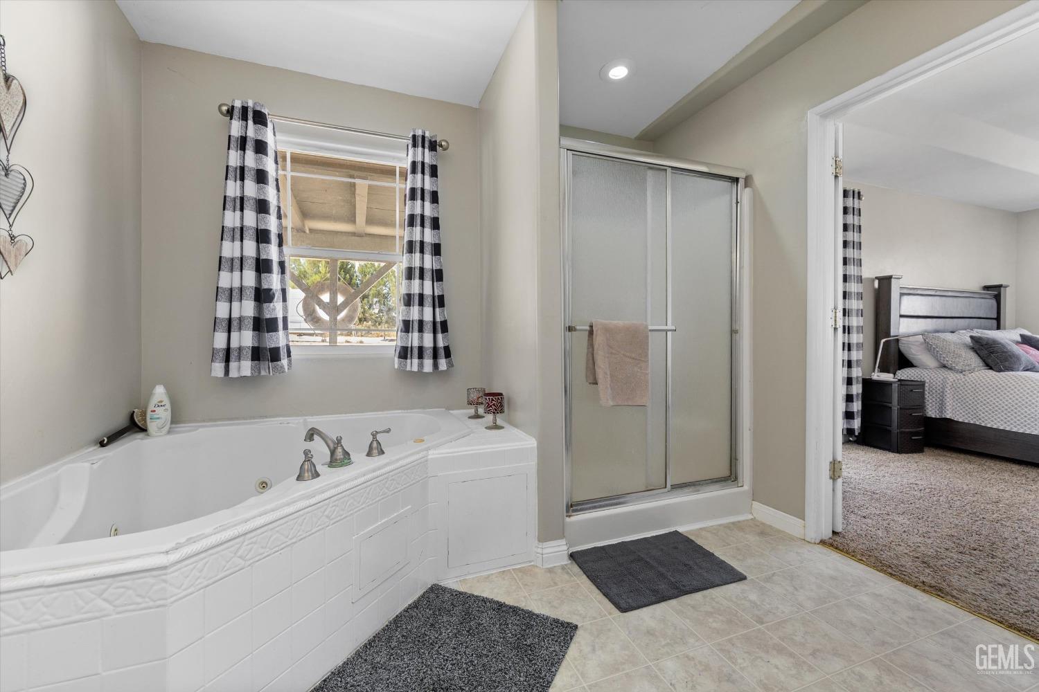 Undisclosed Address Maricopa, CA 93252 - Photo 37 of 47 a bathroom with a bathtub and a shower