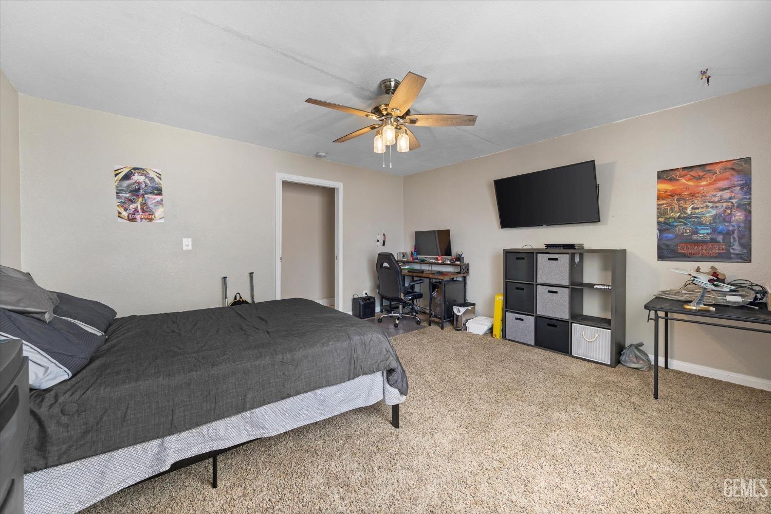 Undisclosed Address Maricopa, CA 93252 - Photo 39 of 47 a bed room with a bed and a television