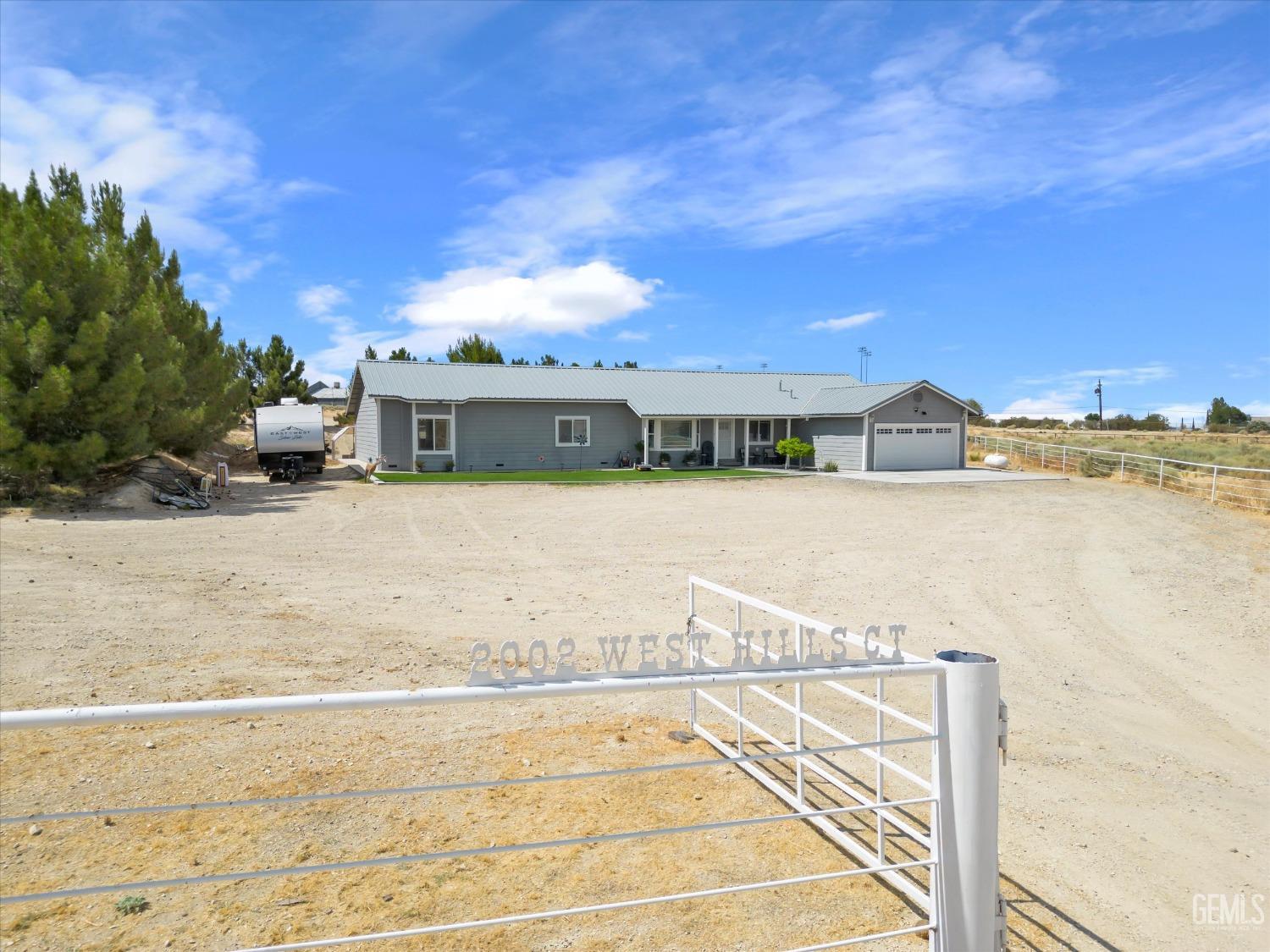Undisclosed Address Maricopa, CA 93252 - Photo 4 of 47 a view of swimming pool with outdoor seating and yard in the back