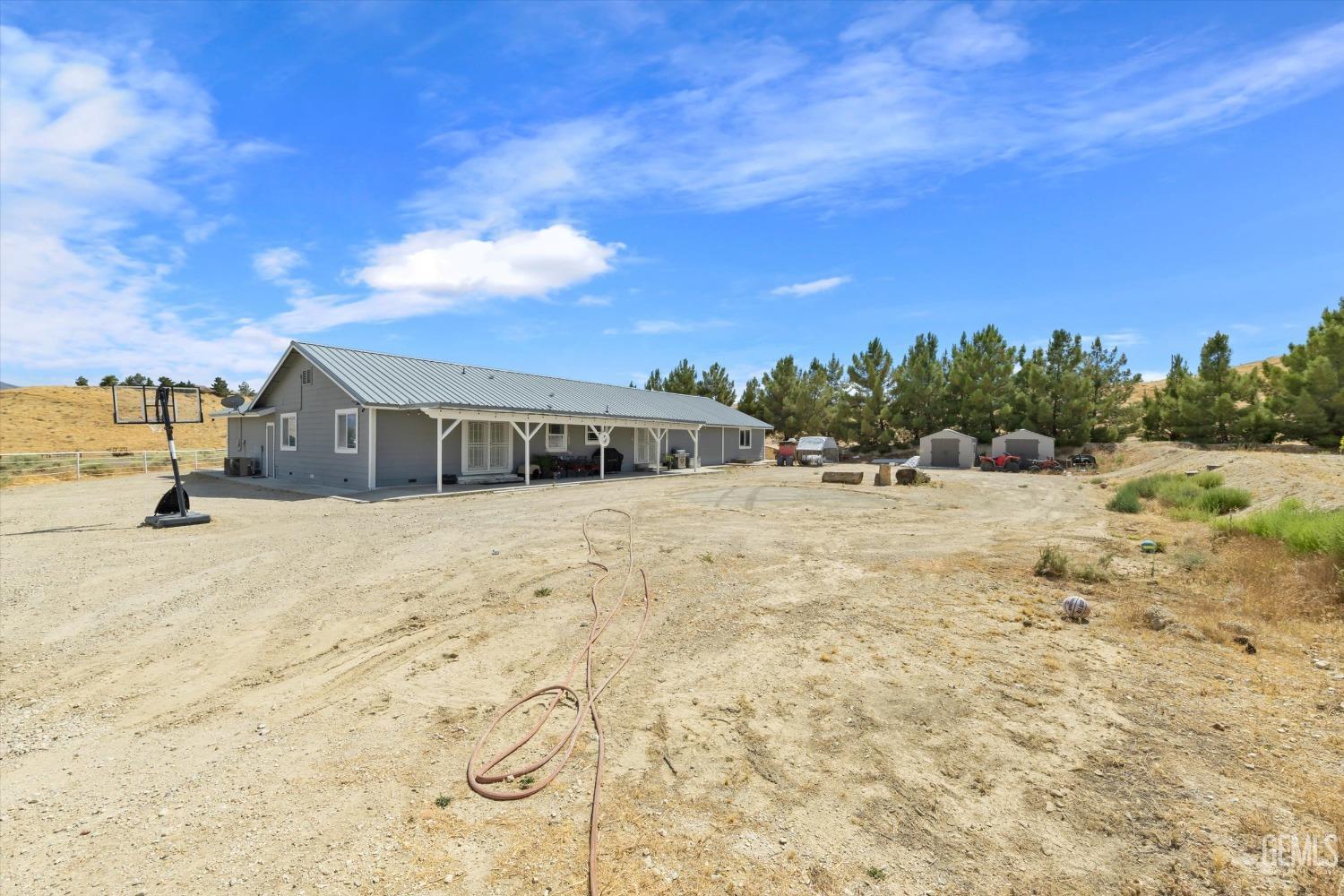 Undisclosed Address Maricopa, CA 93252 - Photo 46 of 47 a yellow house with a yard in front of it