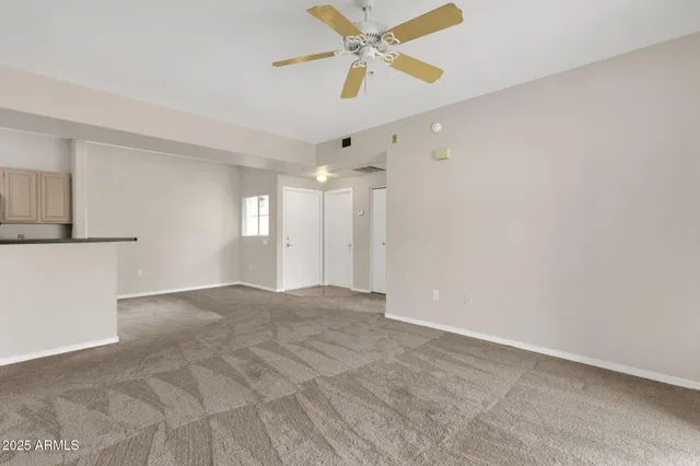 a bathroom with a granite countertop sink a toilet and a mirror