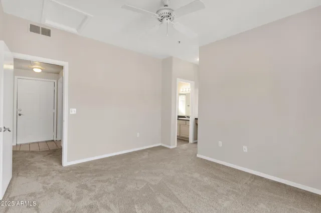 a bathroom with a granite countertop sink toilet a mirror and shower