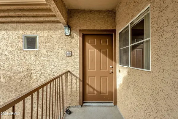 a view of a house with a small yard