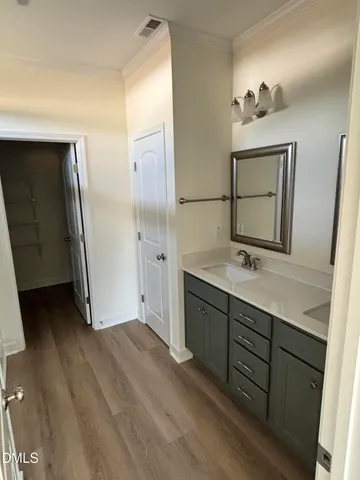 a bathroom with a double vanity sink and mirror