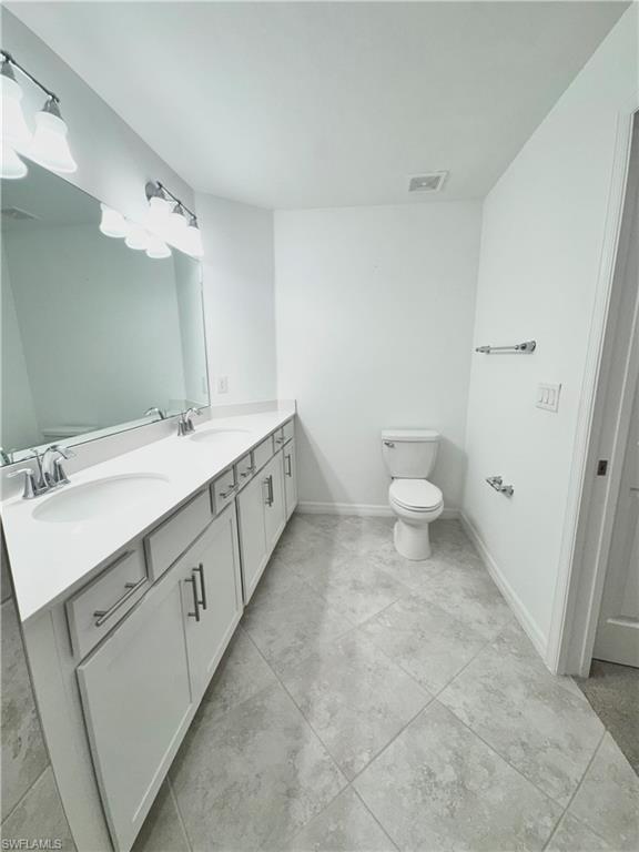 15970 Grassland Lane, Unit 2813 Babcock Ranch, FL 33982 - Photo 8 of 39 Bathroom with vanity and toilet