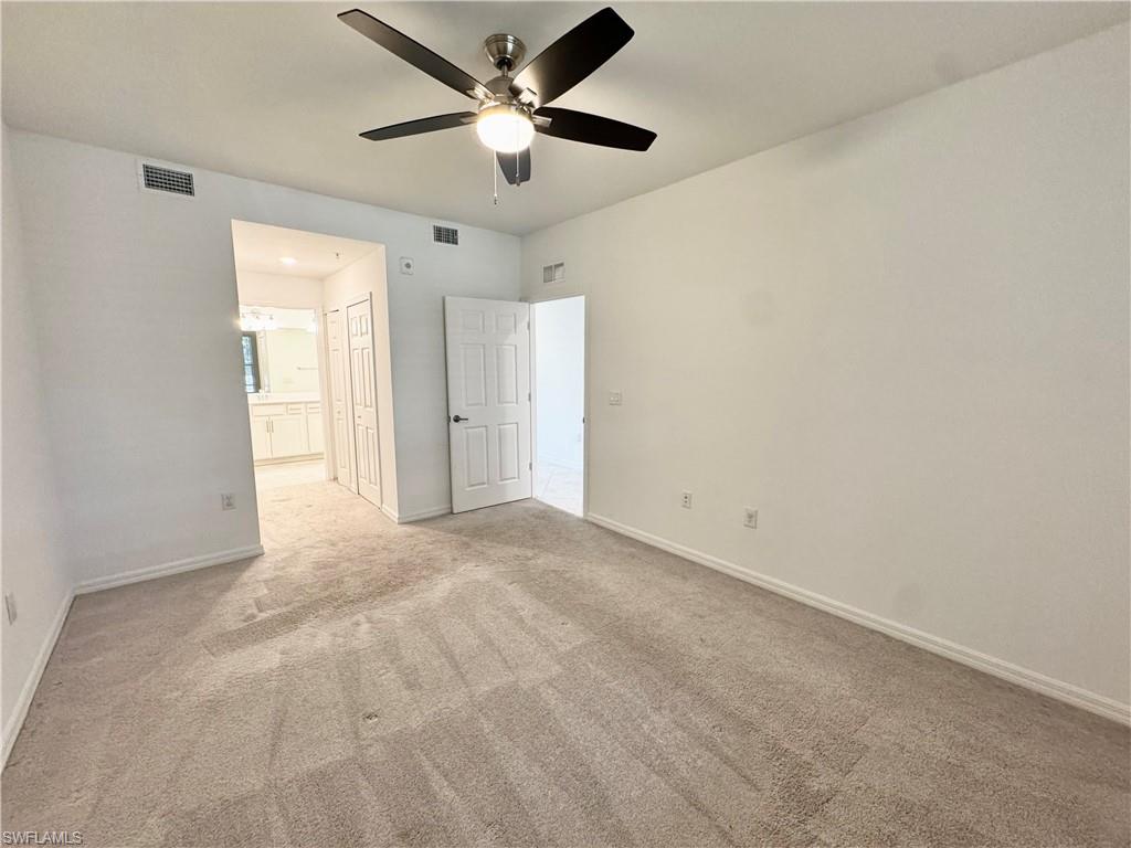 15970 Grassland Lane, Unit 2813 Babcock Ranch, FL 33982 - Photo 10 of 39 Spare room featuring light colored carpet and ceiling fan