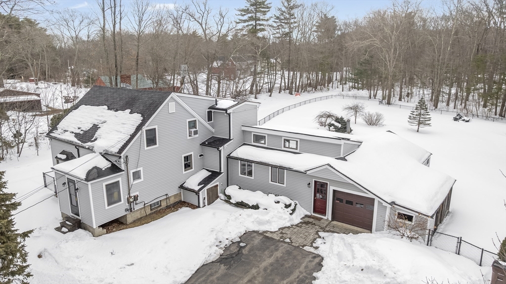54 Rabbit Road Salisbury, MA 01952 - Photo 36 of 37 a view of a white house with a snow in the background