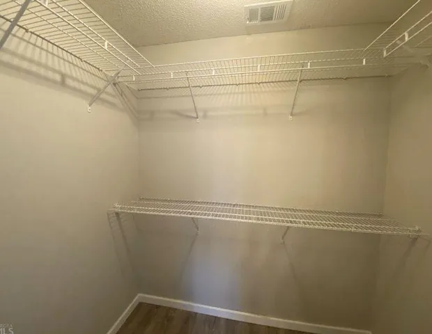 a view of a room with racks on the wall