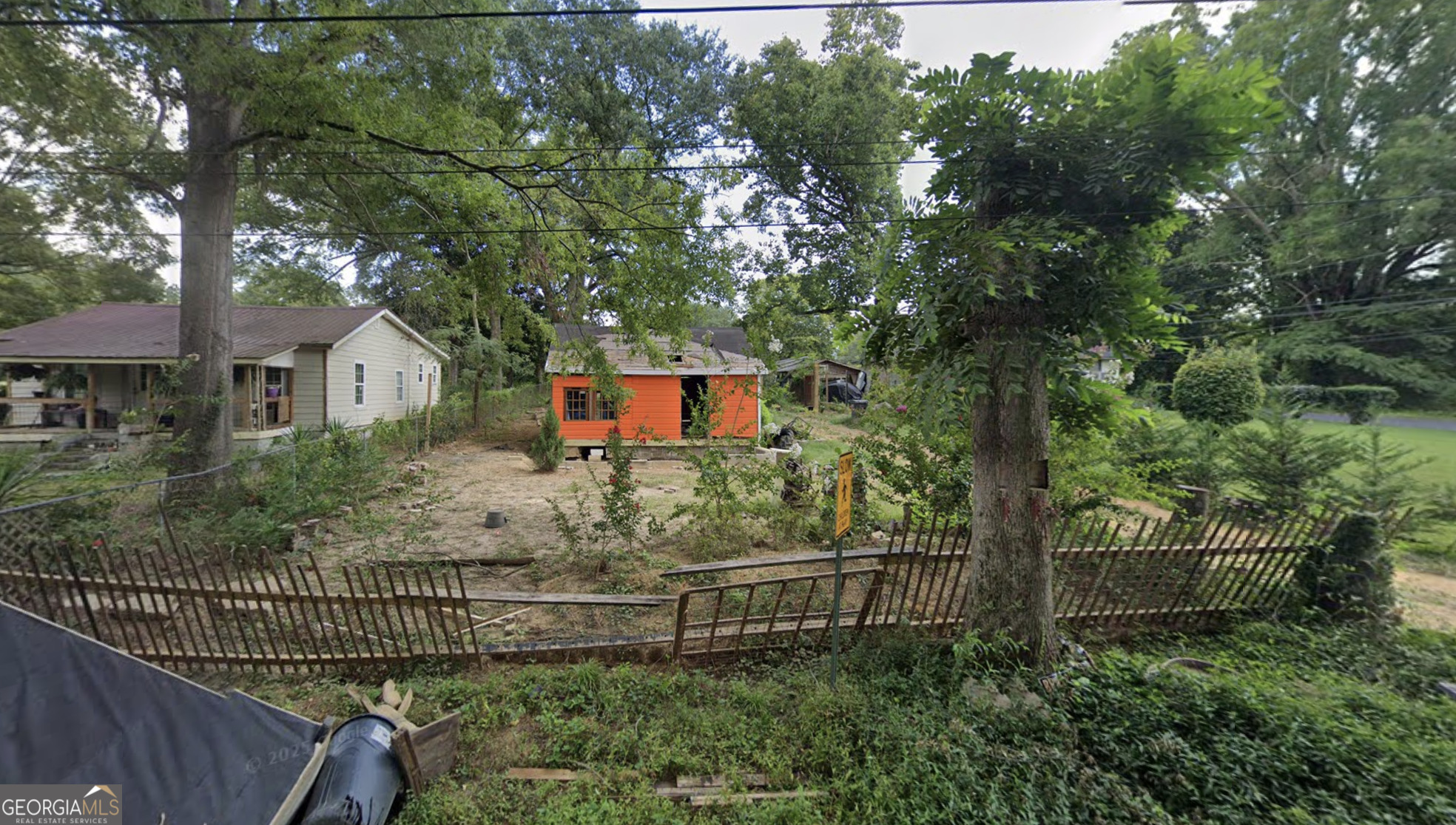 101 Broad Street Summerville, GA 30747 - Photo 3 of 6 a view of a house with a tree in the background