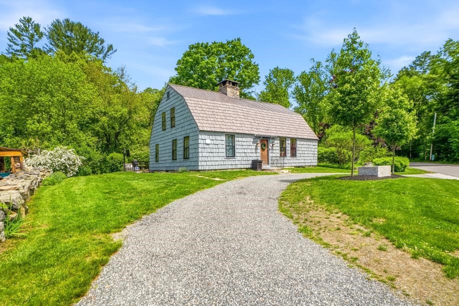 52 Elm Street Upton, MA 01568 - Photo 2 of 42 a house with green field in front of it