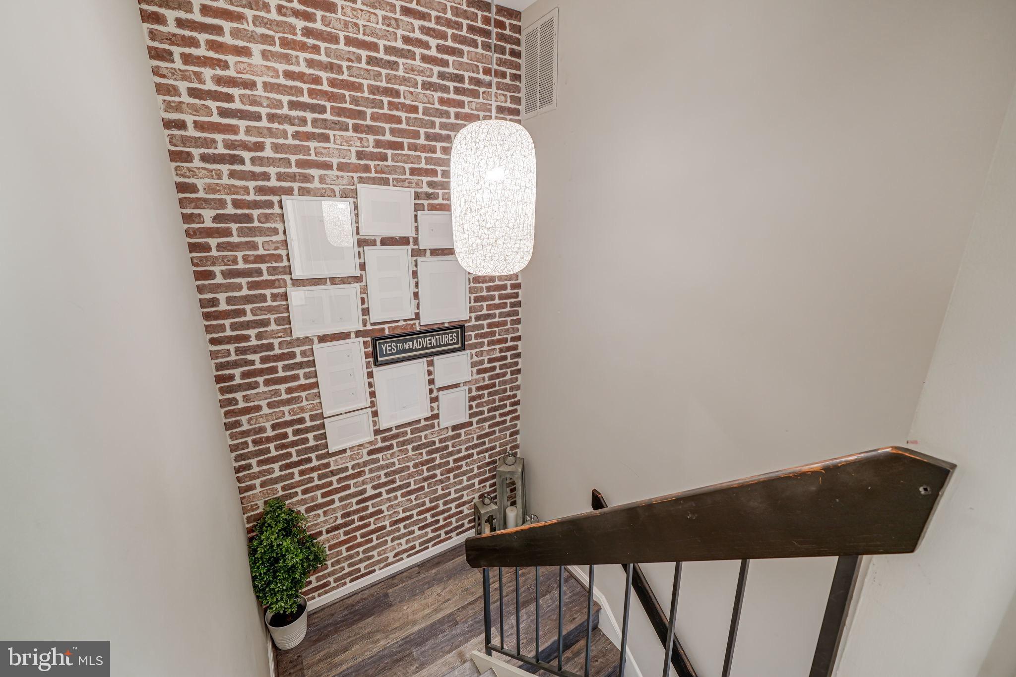 1825 Ivy Oak Square Reston, VA 20190 - Photo 17 of 37 Exposed Brick Wall to upstairs!