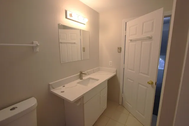 a view of a yard with trees in the background