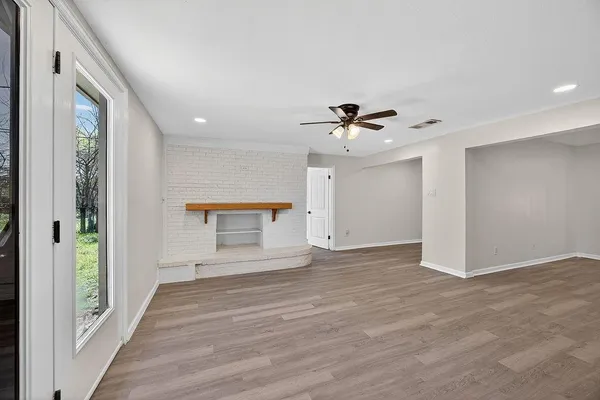 a view of an empty room and glass door