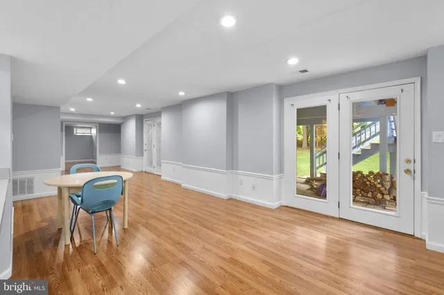 a view of a livingroom with furniture window and wooden floor