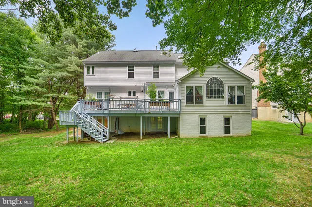 a front view of a house with a yard table and chairs