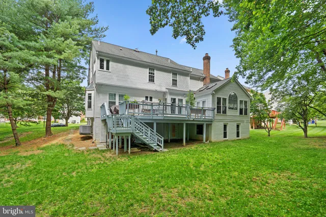 a view of a house with a yard porch and sitting area
