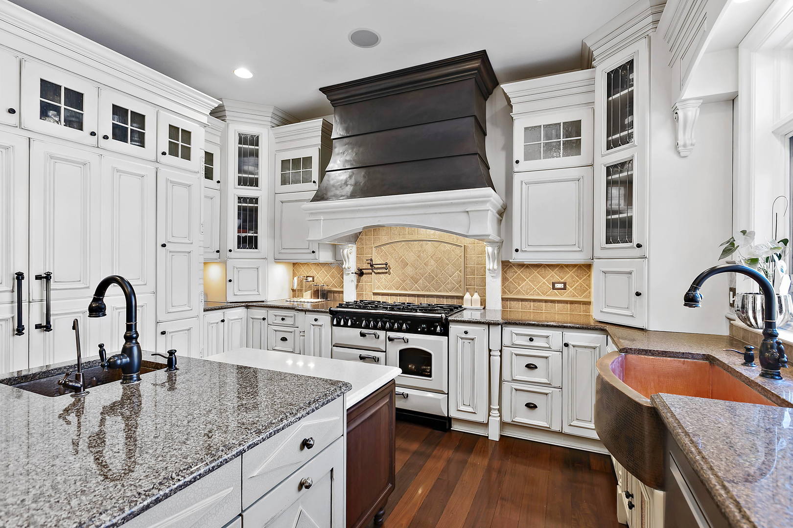 217 North Haman Road Inverness, IL 60010 - Photo 16 of 61 a kitchen with stainless steel appliances granite countertop a stove a sink and a microwave