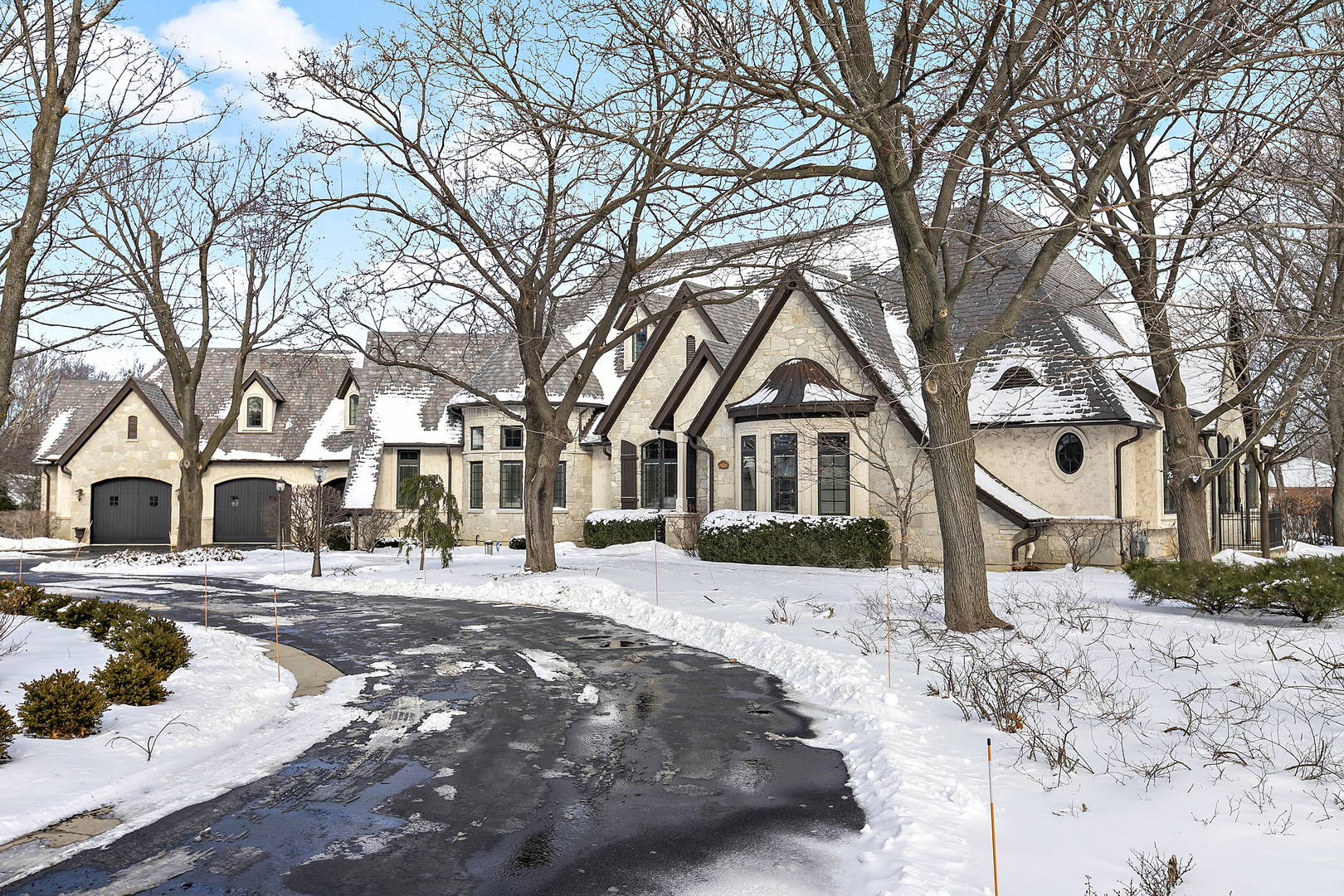 217 North Haman Road Inverness, IL 60010 - Photo 2 of 61 a front view of a house with a yard covered in snow