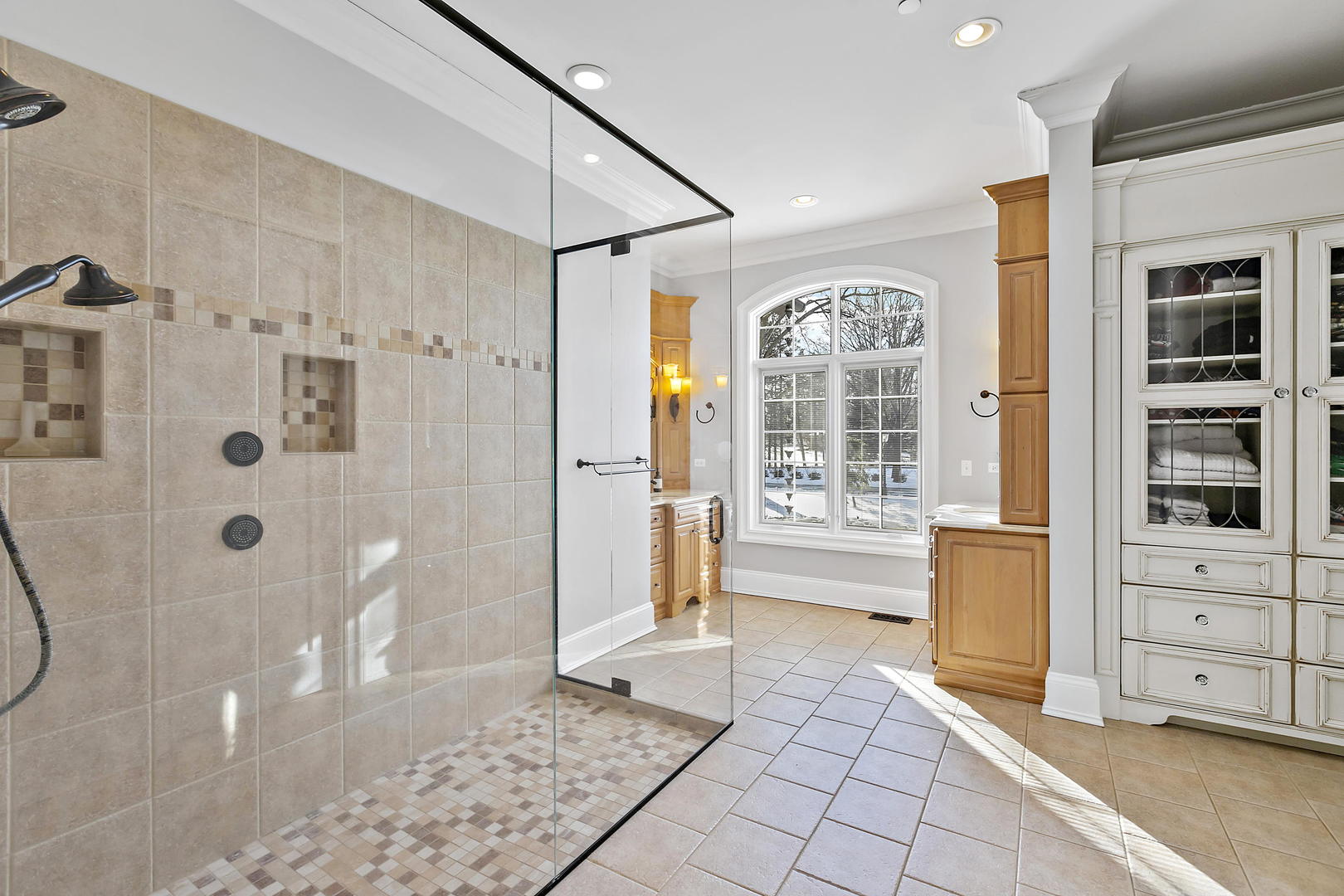 217 North Haman Road Inverness, IL 60010 - Photo 25 of 61 a bathroom with a tub shower and mirror