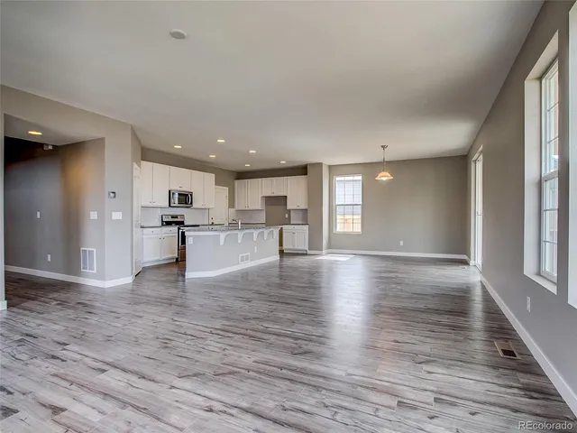 a view of kitchen with wooden floor