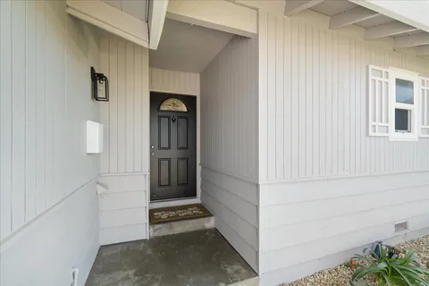 a view of an entryway with a hallway