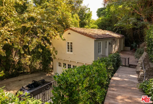 a aerial view of a house with a yard