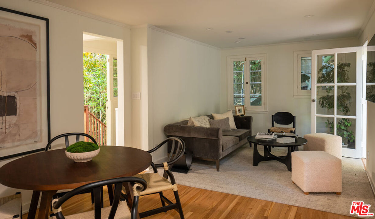 488 St Pierre Road Los Angeles, CA 90077 - Photo 3 of 12 a living room with furniture and a floor to ceiling window
