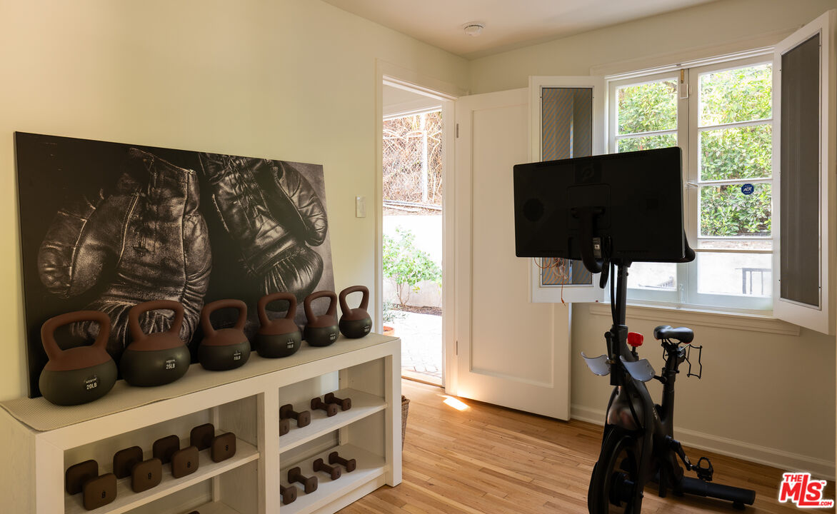 488 St Pierre Road Los Angeles, CA 90077 - Photo 8 of 12 a view of a living room with furniture and flat screen tv