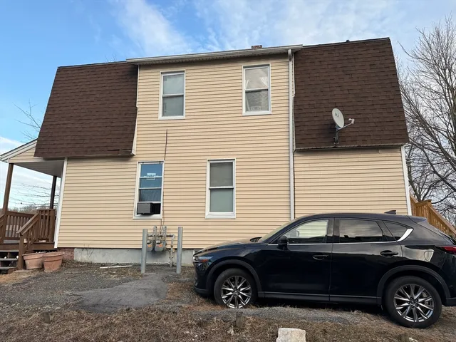 a car parked in front of a house