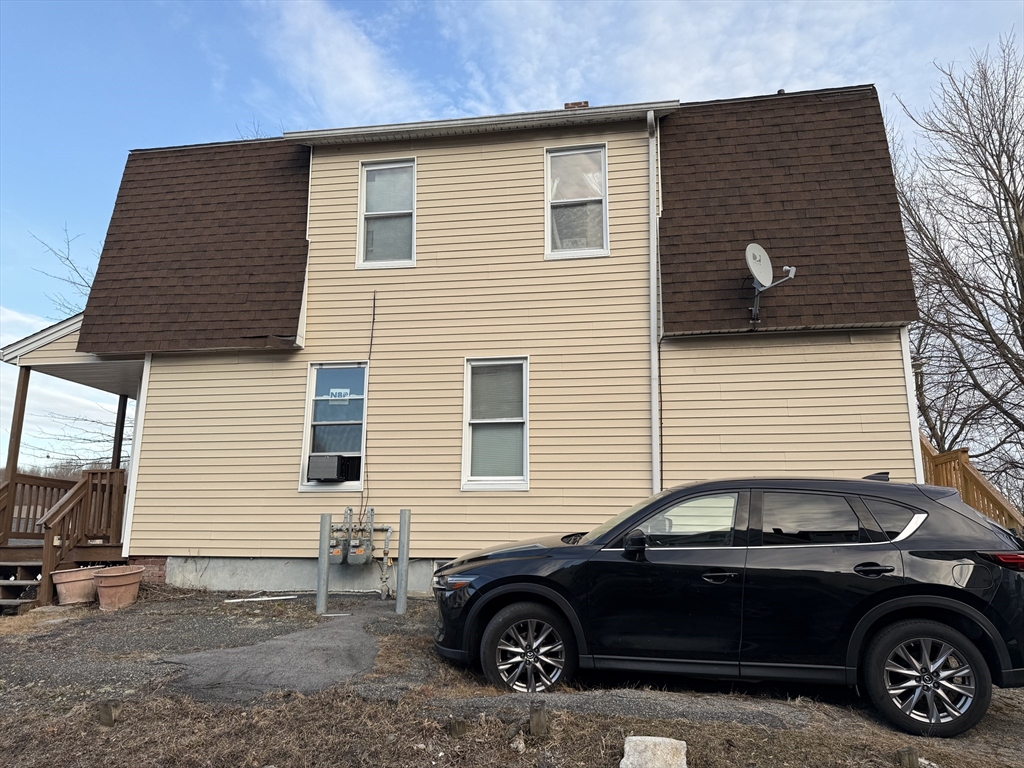 102 Hamilton Street Worcester, MA 01604 - Photo 2 of 3 a car parked in front of a house