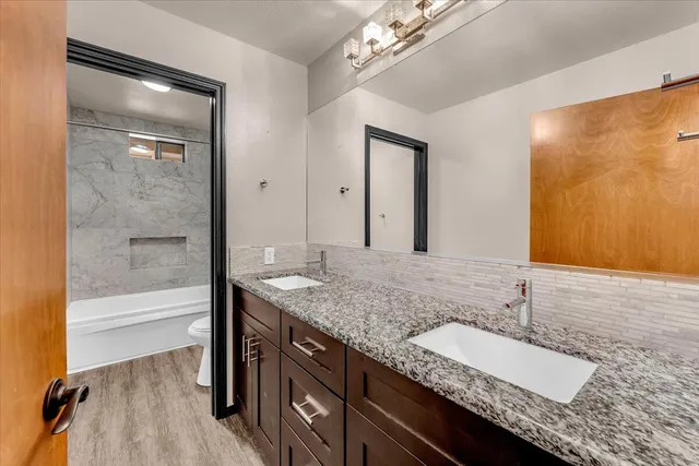 a white bath tub sitting next to a toilet