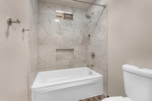 a view of a porch with wooden floor and iron stairs