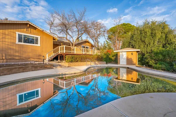 a view of outdoor space with trees all around