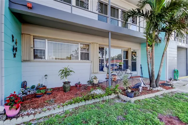 a living room with furniture a rug and a flat screen tv