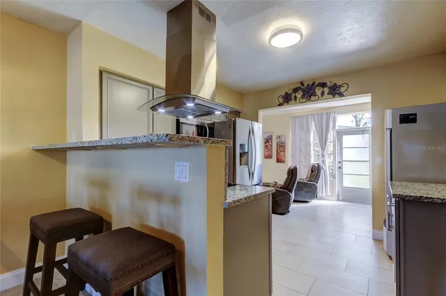 a kitchen with stainless steel appliances granite countertop a stove and a microwave
