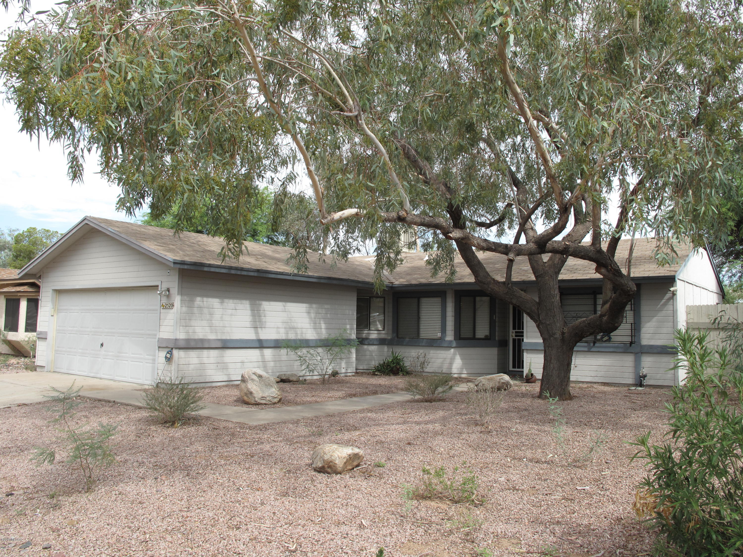 2520 West Fanbrook Road Tucson, AZ 85741 - Photo 1 of 18 a front view of a house with garden