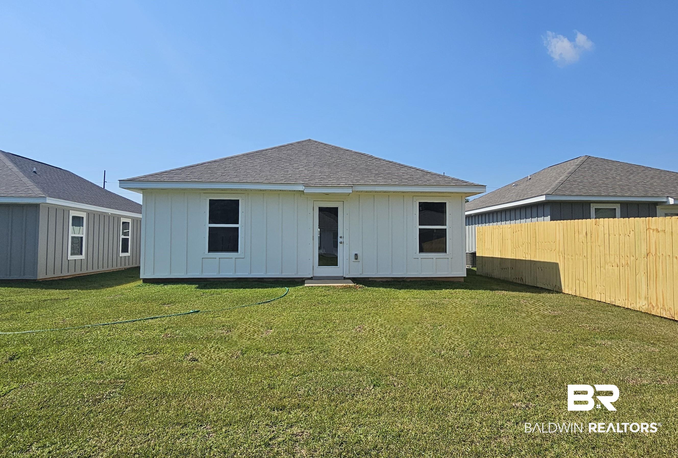 1148 Sweet Laurel Street Foley, AL 36535 - Photo 3 of 18 Rear view of property featuring a yard