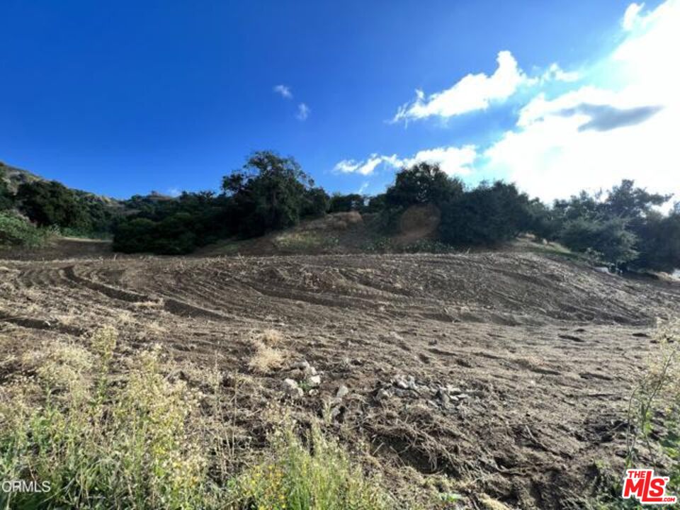 1037 East Becklee Road Glendora, CA 91741 - Photo 4 of 6 a view of a lake with mountain in the back