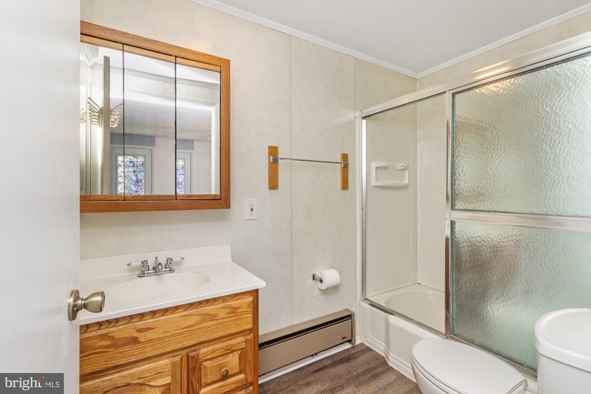 3135 Sollers Point Road Baltimore, MD 21222 - Photo 15 of 36 a bathroom with a sink toilet and shower